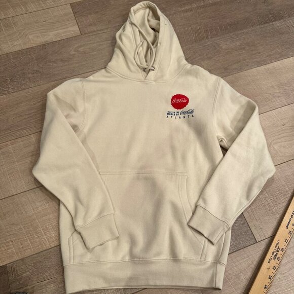 COCA COLA WORLD OF COKE HOODIE SIZE SMALL NWOT - Picture 1 of 7